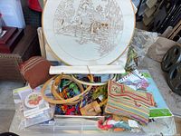 Overall lot showing scenic panel in large hoop with supplies in bin