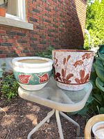 Two planters side by side outdoors showing exterior designs