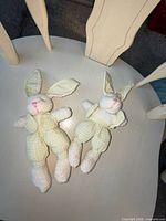 Front view of both bunnies showing outfits and facial details