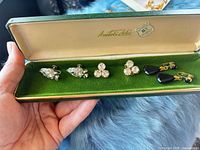 All three earring pairs in presentation box