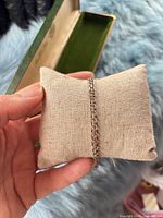 Bracelet displayed on cushion showing full chain