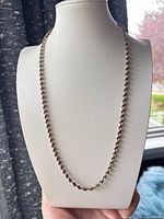 Full view of the sterling silver rope chain necklace on display bust