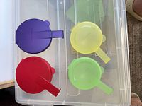 Top view showing four coloured containers closed
