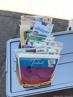 Stack of packaged hosiery showing multiple brands such as Treadwell, Whisper, Secret