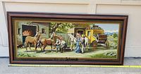 full view of framed needlepoint artwork