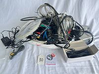 Pile of assorted cables, one Schiit component and boxed cables visible