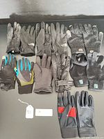 All seven glove pairs laid out front view