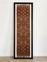 Full view of framed silk textile