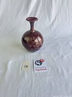 Full view of vase on white backdrop showing shape and finish