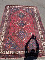 Full view of Persian rug showing design and overall condition