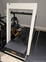 Front view of Landice L7 treadmill showing frame, belt, and front hood