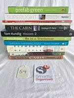 Full stack of 11 hardcover books with lot tag