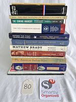 Full stack showing 12 book spines for identification and count