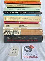 Stack of all 12 book spines showing titles and authors