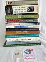 Full stack of 13 books with spines visible