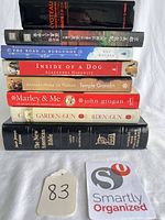Stack of all eight books showing spines for identification