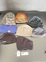 All eight hats laid out showing variety