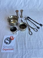 All seven silver-plated pieces grouped