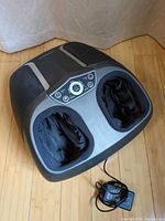 Top view of Nekteck foot massager with adapter