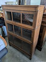 Front view of oak barrister bookcase with three glass-front sections