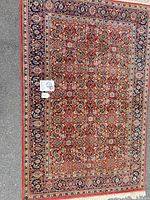 Full view of oriental rug showing design and colors