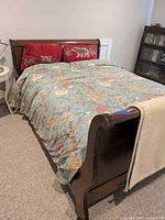 Bed assembled showing footboard curvature and finish