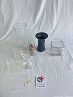 Group shot of all six vases on white backdrop