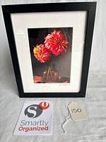Framed photograph standing upright showing full piece with organizing card and lot tag