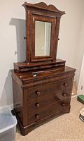 Full view of dresser with attached mirror