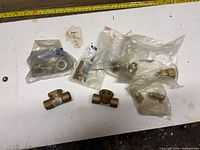 Group view of all brass fittings on table