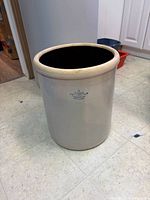 Front view of gray salt-glaze crock with crown "8" stamp