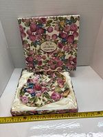 Tray in satin insert within floral box