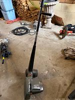 Full view of Black & Decker corded lawn edger showing body, wheels and handle