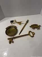 Group shot showing all five brass items