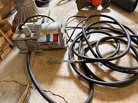 Compressor with coiled hose and chuck