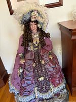 Front view of Cathay Victorian porcelain floor doll in full gown and bonnet