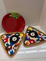 Tomato platter and two pool ball platters with dip bowls displayed