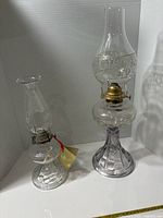 Both oil lamps side by side showing overall form and relative sizes