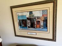 Front view of framed print on wall