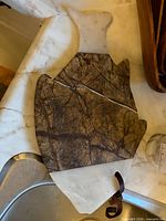 Full view of fish-shaped marble board on countertop