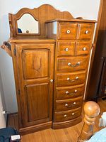 Full view showing cabinet door, drawers, mirror, towel bar