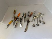 All utensils laid out on white background