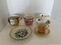 All seven porcelain pieces grouped