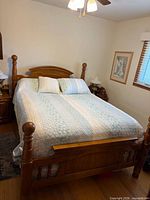 Whole bed assembled showing headboard, footboard, mattress, boxspring