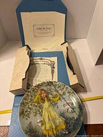 Plate displayed with COA and open presentation box