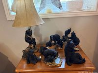 All items on dresser including lamp, night light and multiple bear figurines