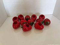 Group view of all 12 wooden strawberry napkin rings