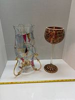 Front view of both decorative glass pieces side by side with measuring tape