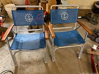 Pair of blue mesh foldable patio chairs front view
