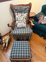 Glider chair with ottoman, pillows, plaid upholstery